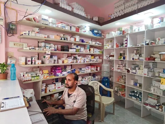 Pharmacy counter and medicine shelves inside Pandey Medical Agency